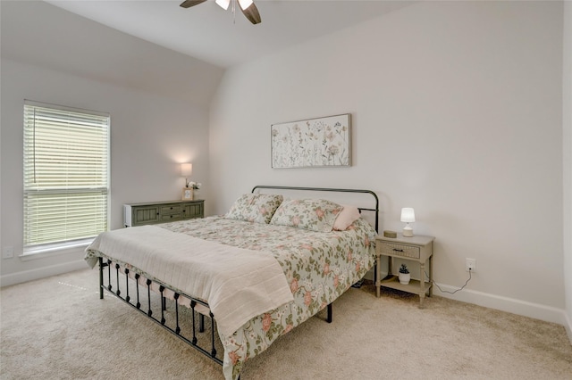 carpeted bedroom featuring ceiling fan and vaulted ceiling