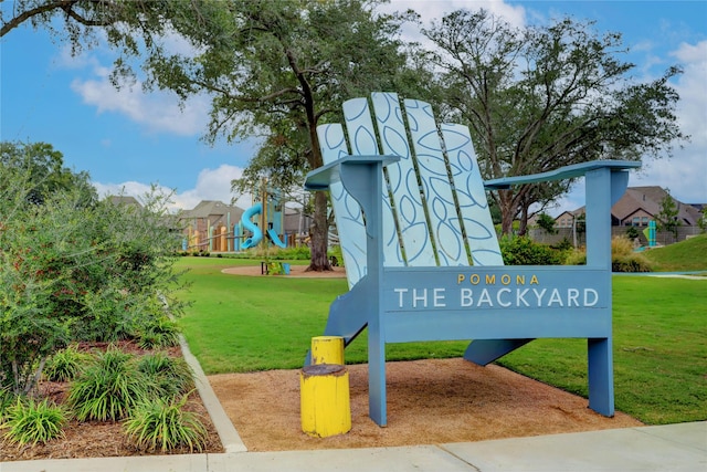 exterior space featuring playground community and a lawn