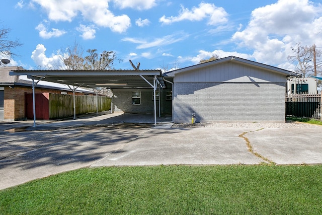 back of house with a carport