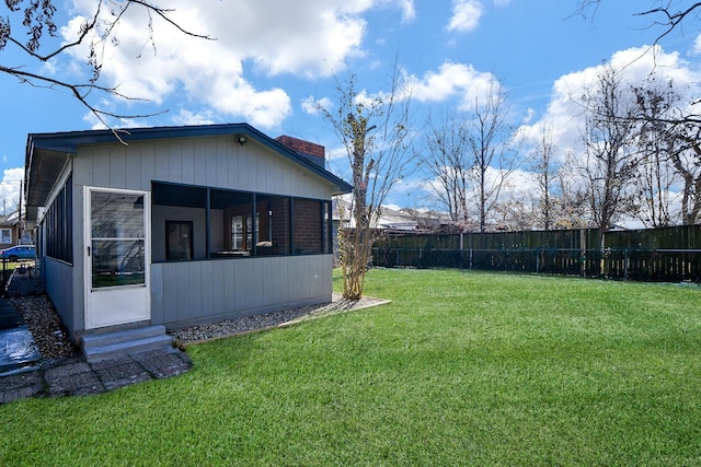 view of yard featuring a sunroom