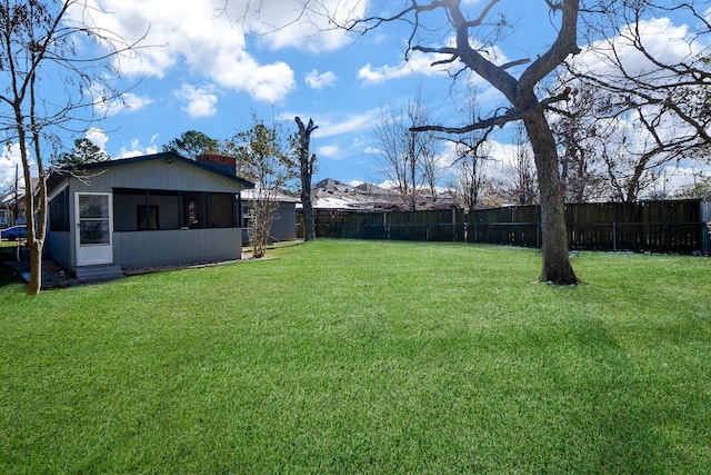 view of yard with a sunroom