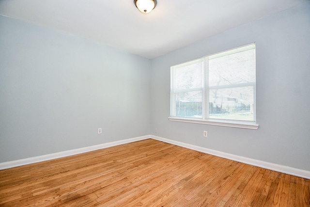 spare room with light wood-type flooring