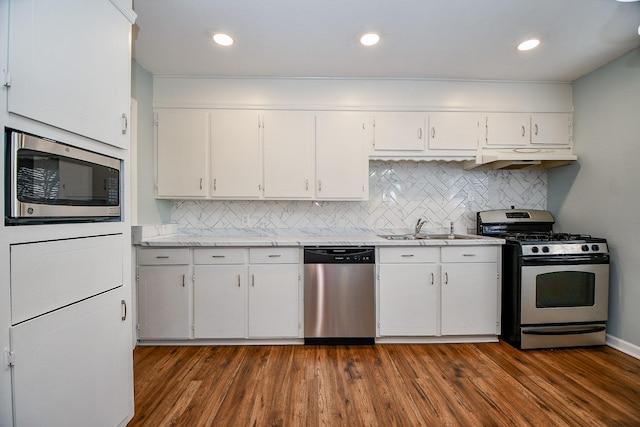 kitchen with white cabinetry, appliances with stainless steel finishes, and sink