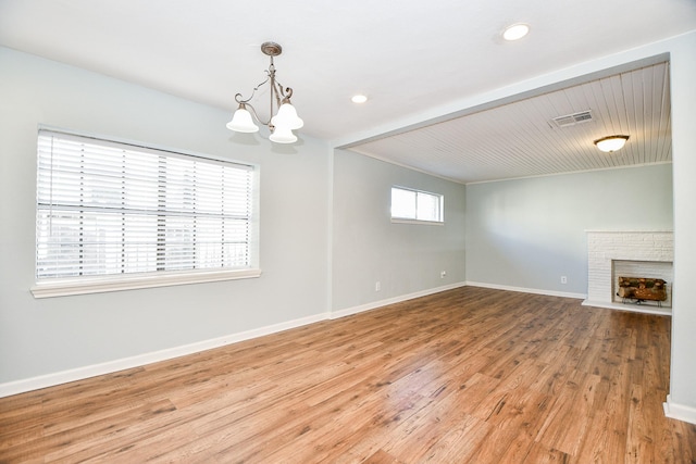 interior space featuring an inviting chandelier and hardwood / wood-style flooring