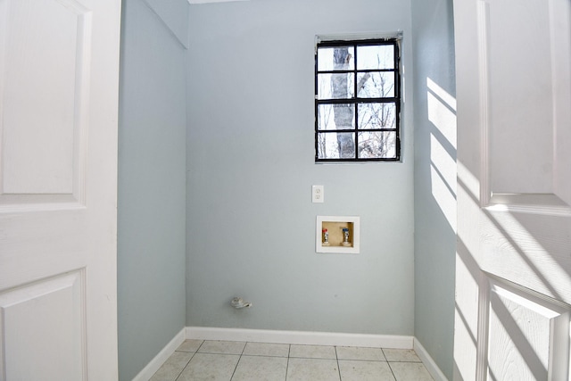 laundry area featuring washer hookup and light tile patterned floors