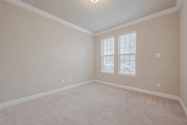 unfurnished room with crown molding and light carpet