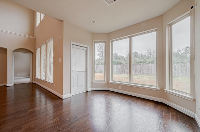 empty room with dark wood-type flooring