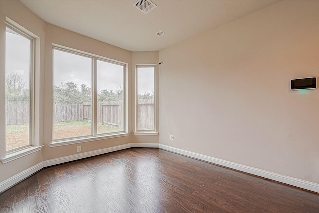 spare room featuring hardwood / wood-style floors