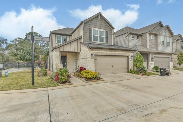 view of front of property featuring a garage and a front lawn