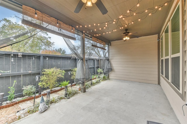 view of patio featuring ceiling fan