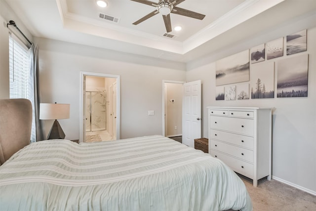 bedroom with ornamental molding, a raised ceiling, and light carpet