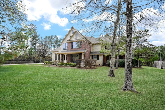 view of front of house featuring a front yard and covered porch