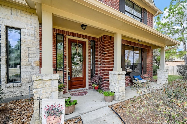 doorway to property with covered porch