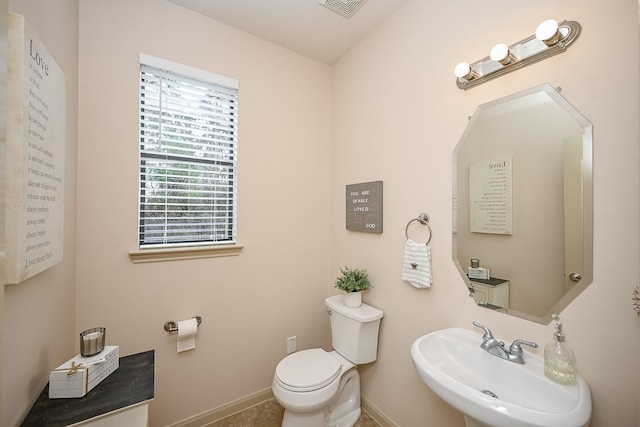 bathroom featuring sink and toilet