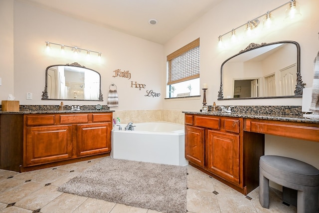 bathroom featuring vanity and a tub