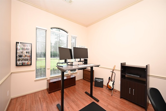 office area featuring light hardwood / wood-style flooring and ornamental molding