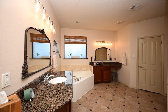 bathroom featuring vanity and a bathtub