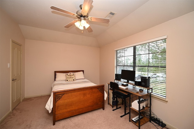 carpeted bedroom featuring multiple windows, lofted ceiling, and ceiling fan