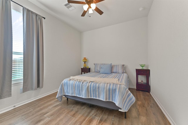 bedroom with hardwood / wood-style flooring and ceiling fan