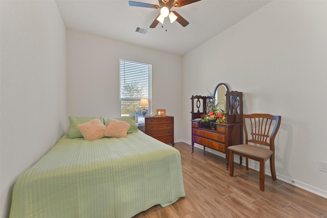 bedroom with hardwood / wood-style flooring and ceiling fan