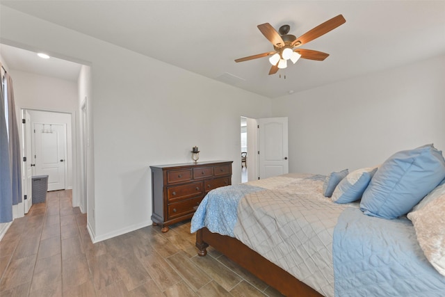 bedroom with hardwood / wood-style flooring and ceiling fan