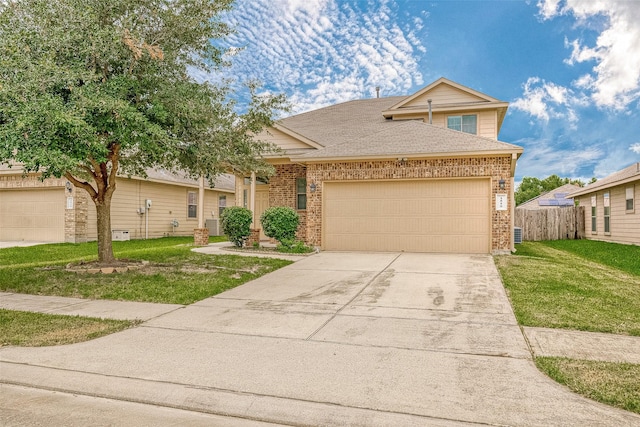 view of front of home with a garage and a front yard