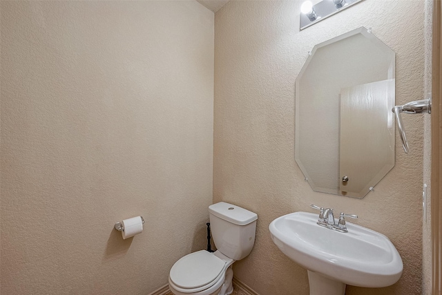 bathroom with toilet and sink