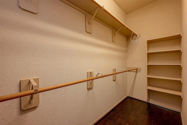 spacious closet featuring hardwood / wood-style floors