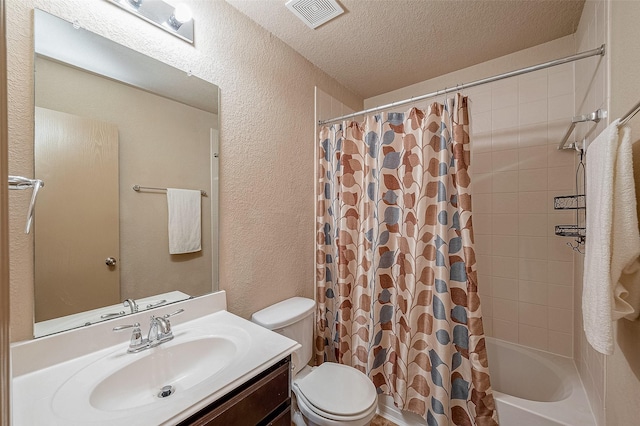 full bathroom featuring vanity, shower / tub combo, a textured ceiling, and toilet