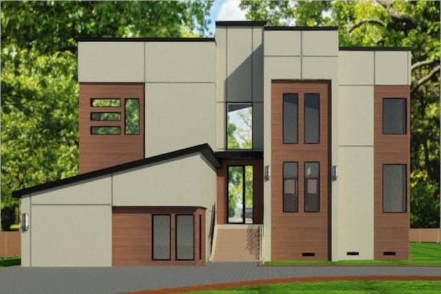 back of property featuring stucco siding