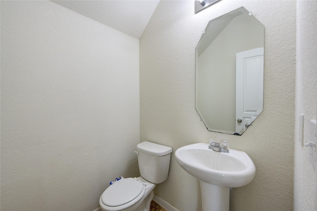 bathroom featuring sink and toilet