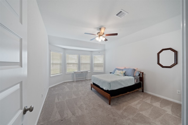 bedroom featuring light carpet and ceiling fan