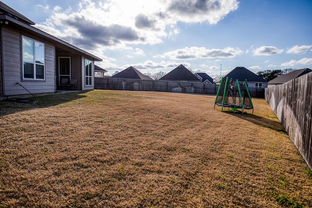 view of yard with a trampoline