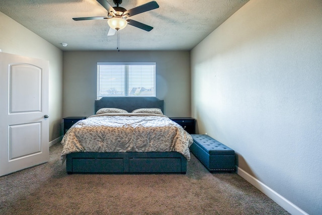 bedroom featuring ceiling fan, carpet flooring, and a textured ceiling