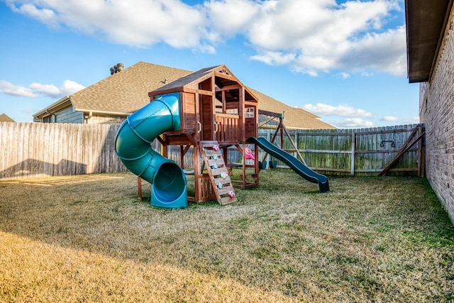 view of jungle gym featuring a lawn