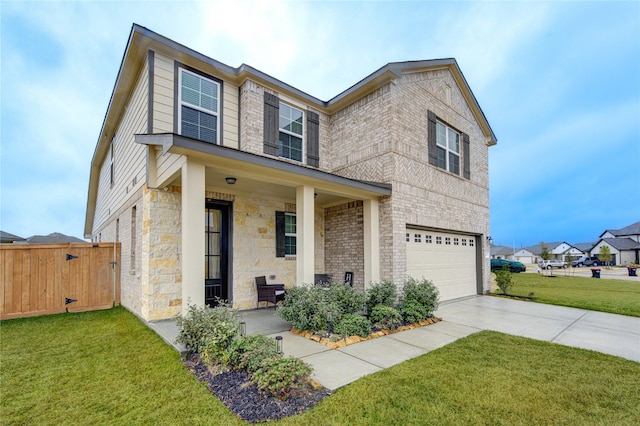 view of front of house featuring a garage, covered porch, and a front lawn