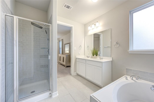 bathroom featuring vanity, tile patterned floors, and plus walk in shower