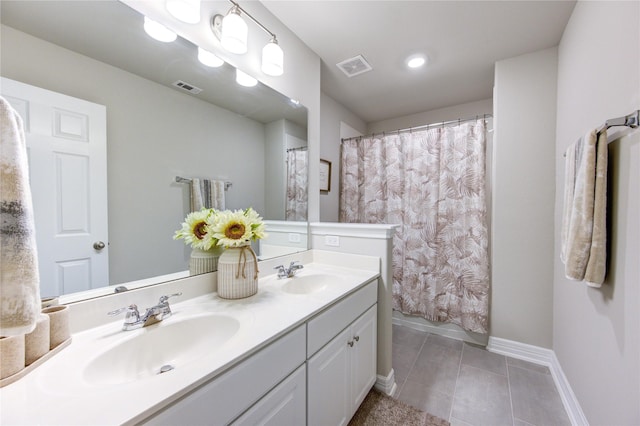 bathroom with tile patterned flooring and vanity