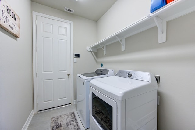 clothes washing area featuring washing machine and dryer