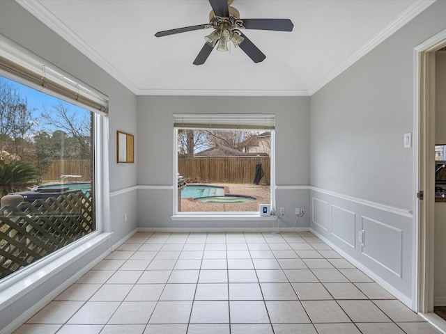 unfurnished sunroom with plenty of natural light and ceiling fan