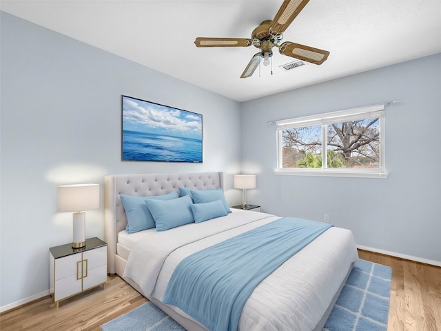 bedroom featuring ceiling fan and light hardwood / wood-style floors