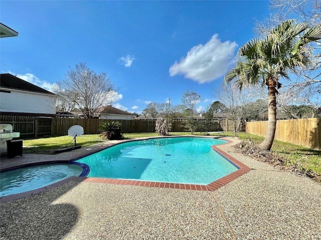 view of swimming pool featuring an in ground hot tub and a patio area