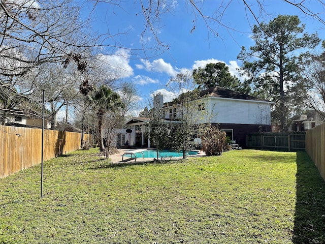 view of yard with a fenced in pool