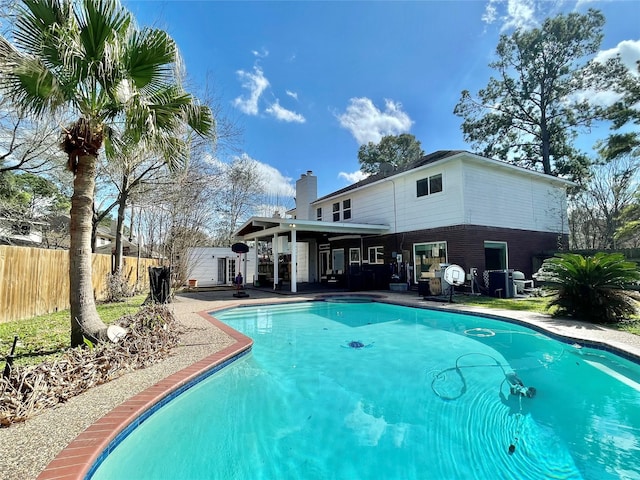 view of swimming pool featuring a patio