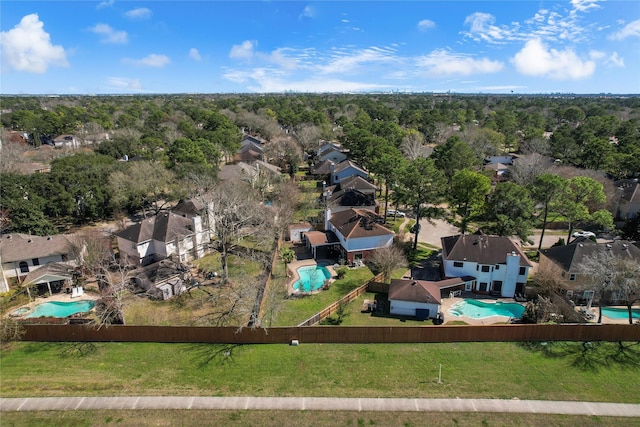 bird's eye view featuring a wooded view