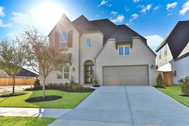 view of front of home with a garage and a front yard