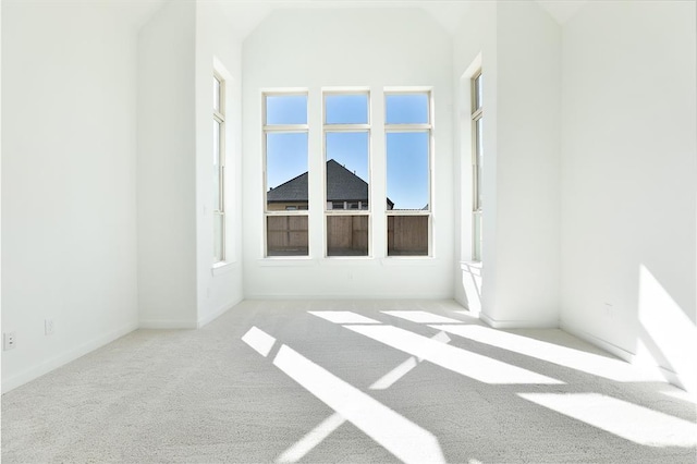 unfurnished room featuring light colored carpet