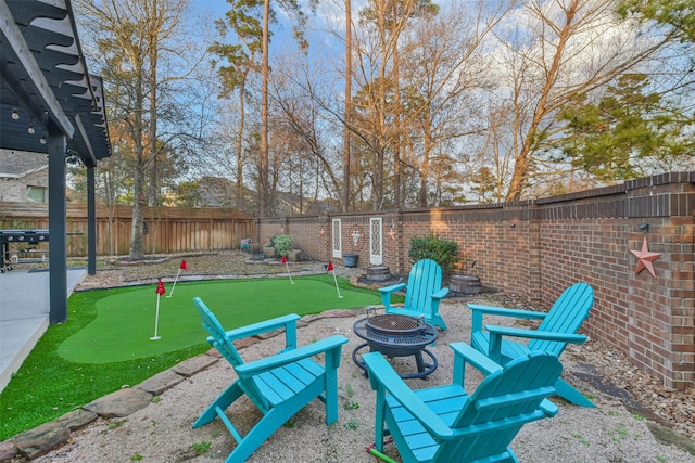 view of patio with a fire pit