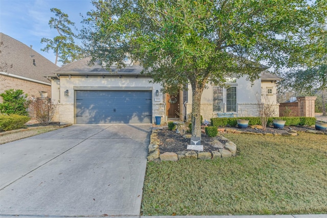 view of front of property featuring a garage and a front yard