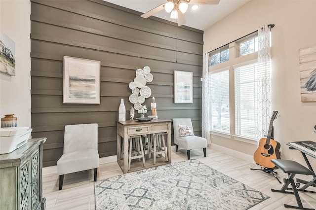 living area with ceiling fan